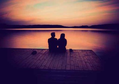 couple on beach at sunset, background image for hold me tight registration