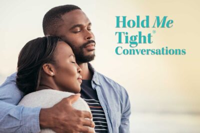 African American couple holding each other tight on beach-hold me tight Seattle