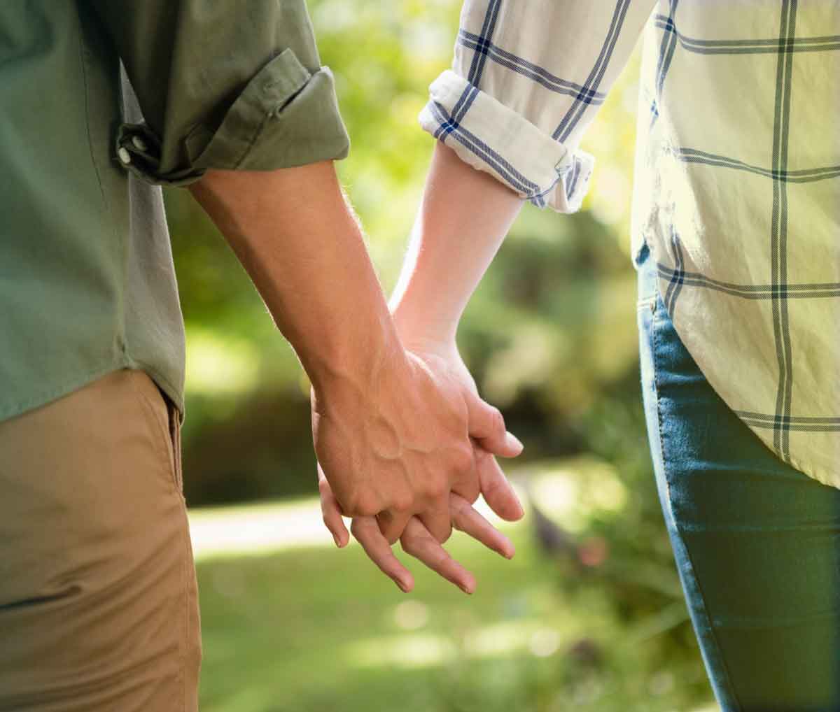 white couple holding hands hold me tight Seattle registration background