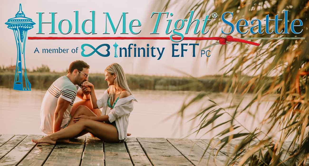 happy couple sitting on talk talking with hold me tight Seattle logo